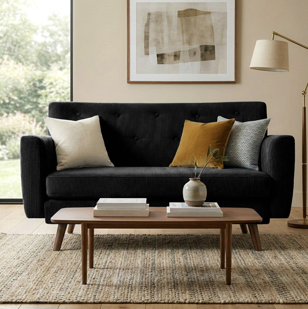 Canapé en velours côtelé noir dans un salon